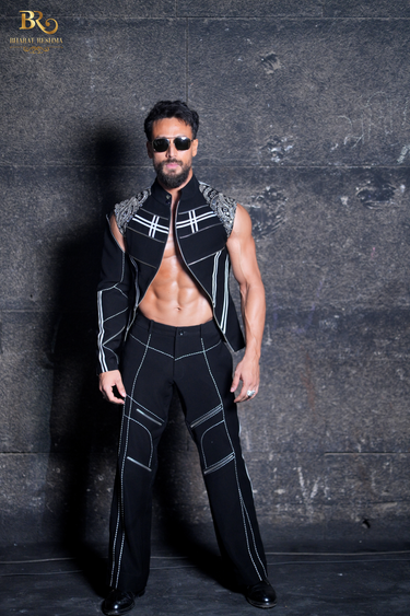Tiger Shroff Wearing Our Statement Black Jacket Featuring One Sleeve Detail - Bharat Reshma