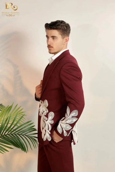 maroon-colored suit with white embroidery
